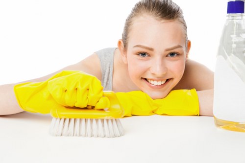Cleaning technician inspecting fabric condition before treatment